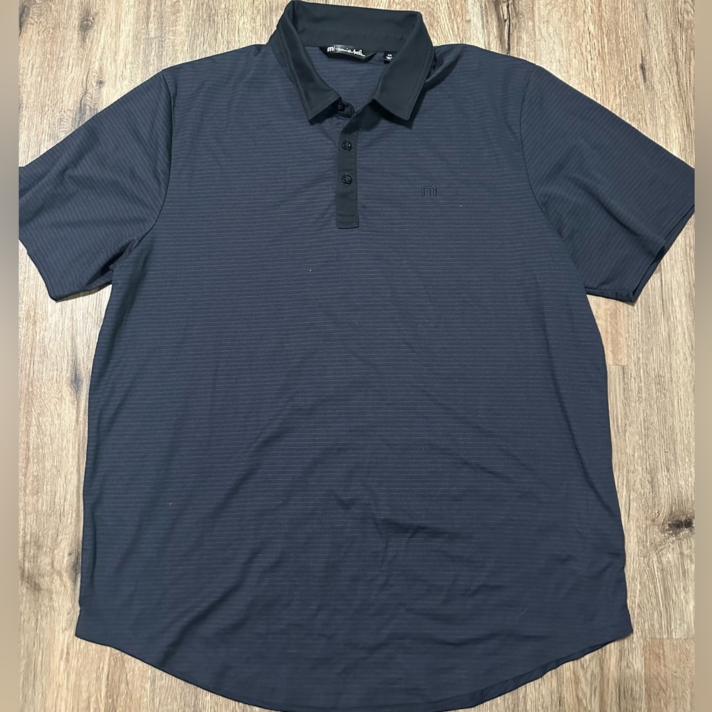 Travis Mathew men’s golf polo shirt.